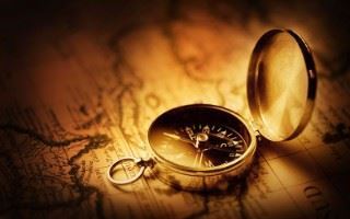 Tall ship and a compass